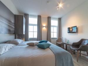 Postel nebo postele na pokoji v ubytování Holiday Home Ganuenta-1 by Interhome