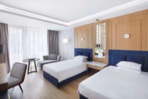 Ένα ή περισσότερα κρεβάτια σε δωμάτιο στο Grand Hyatt Athens +37 φωτογραφίες