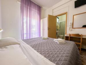 Letto o letti in una camera di Hotel Stradiot