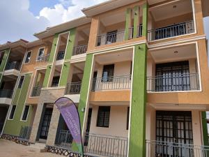 a building with a surfboard in front of it at Orgonite SmartHomes in Kampala