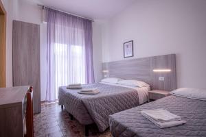 Letto o letti in una camera di Hotel Stradiot