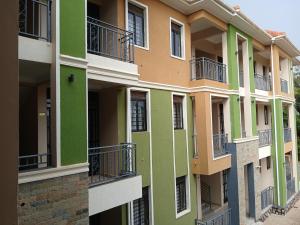 a facade of an apartment building with green at Orgonite SmartHomes in Kampala