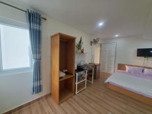 Postel nebo postele na pokoji v ubytování MrLee Dalat House