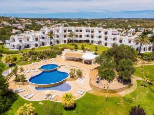 an aerial view of a resort with a swimming pool at Albufeira Family Holidays with Pool View in Albufeira