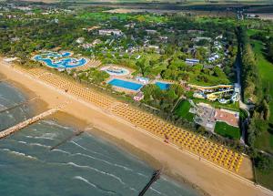 an aerial view of a beach with a resort at Pra' delle Torri Village in Caorle