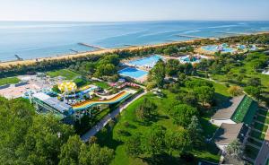 an overhead view of a water park next to the ocean at Pra' delle Torri Village in Caorle