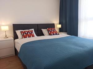 Posteľ alebo postele v izbe v ubytovaní Apartament CENTRUM/STARÓWKA Gdańsk