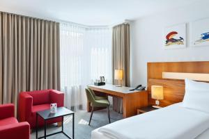 Una cama o camas en una habitación de Austria Trend Hotel Europa Graz Hauptbahnhof 37 fotos más