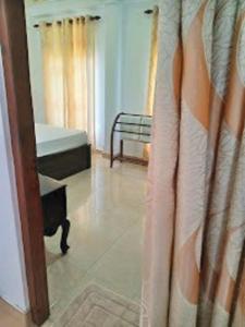 Postel nebo postele na pokoji v ubytování Anu Homestay