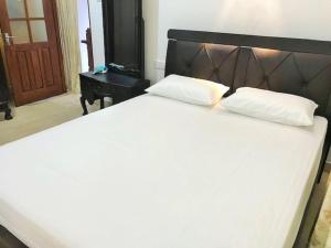 Postel nebo postele na pokoji v ubytování Anu Homestay