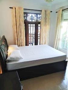 Postel nebo postele na pokoji v ubytování Anu Homestay