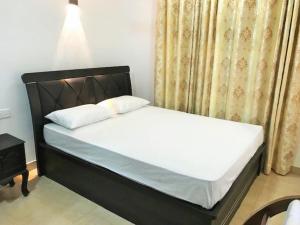 Postel nebo postele na pokoji v ubytování Anu Homestay