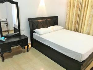 Postel nebo postele na pokoji v ubytování Anu Homestay
