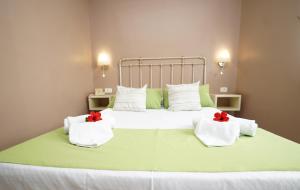 Ein Bett oder Betten in einem Zimmer der Unterkunft Hotel RF Astoria - Adults Only