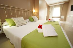 Postel nebo postele na pokoji v ubytování Hotel RF Astoria - Adults Only + 22 fotografií