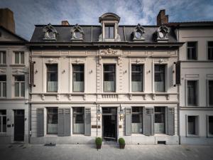 a large white building with windows and doors at CH Longstay 2 in Kortrijk +14 photos