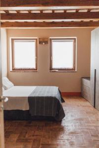 Postel nebo postele na pokoji v ubytování Podere Biricocolo - Il Cortile