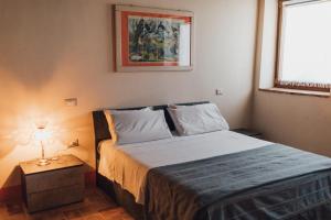 Postel nebo postele na pokoji v ubytování Podere Biricocolo - Il Cortile