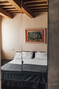 Postel nebo postele na pokoji v ubytování Podere Biricocolo - Il Cortile