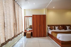 Voodi või voodid majutusasutuse Radhe Krishna Resort toas