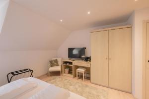 TV a/nebo společenská místnost v ubytování Hotel De Baian