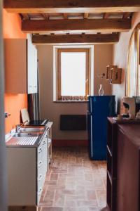 Kuchyň nebo kuchyňský kout v ubytování Podere Biricocolo - Il Cortile