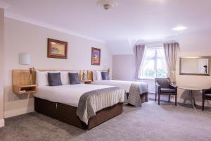 Letto o letti in una camera di The Harbour Inn