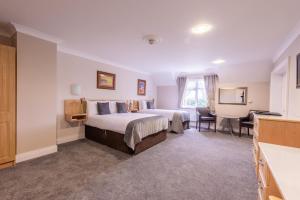 Letto o letti in una camera di The Harbour Inn