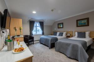 Letto o letti in una camera di The Harbour Inn