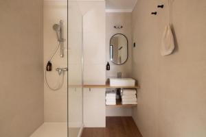 a bathroom with a shower and a sink at Korner Opera in Paris