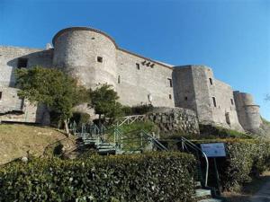 a large stone building with stairs in front of it at Dimora Marconi in Vibo Valentia