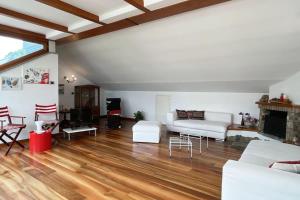 a living room with white furniture and a fireplace at House Bluette - Affitti Brevi Italia in Malgrate +14 photos