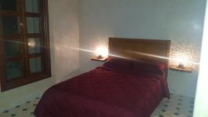 Kama o mga kama sa kuwarto sa Gîte ferme avec piscine privée