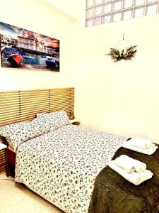 A bed or beds in a room at Antonella home b&b