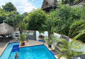 an aerial view of a swimming pool in a resort at hotel Tayrona Angel Lodge cerca a la entrada el zaino parque nacional tayrona in El Zaino