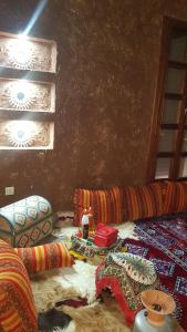Ruang duduk di Gîte ferme avec piscine privée
