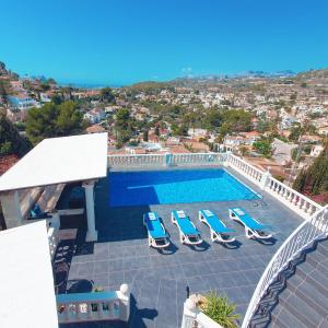 a view of a swimming pool with lounge chairs at Apartment at Casa Piña Blanca in Benissa