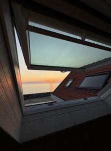 a view of the ocean from a window of a boat at Villa Bord de Mer, Vue Océan et Accés Plage in Soulac-sur-Mer +49 photos