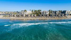 a body of water with a beach with a group oficans at Northcoast Village ocean views in Oceanside