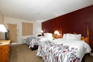 En eller flere senger på et rom på Red Roof Inn & Suites Hazleton