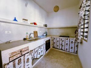a kitchen with a sink and a counter top at Dream House in Watamu