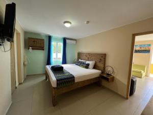 Postel nebo postele na pokoji v ubytování Mustique Suites Curacao