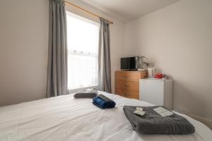 Postel nebo postele na pokoji v ubytování Moonside Rooms