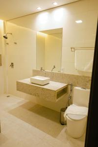 Koupelna v ubytování Oásis Hotel