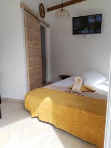 a bedroom with a bed with a stuffed animal on it at Mankao in Les Trois-Îlets