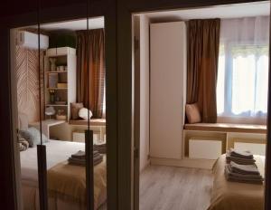 Postel nebo postele na pokoji v ubytování City flat near Bulgaria mall