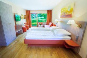 Postel nebo postele na pokoji v ubytování Wohlfühlhotel Sonnengarten