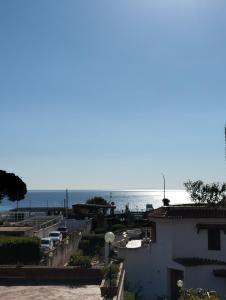 a view of the ocean from a building at Blue Charm Maison in Aci Castello