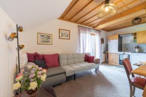 a living room with a couch and a table at Appartements K62 in Bad Mitterndorf