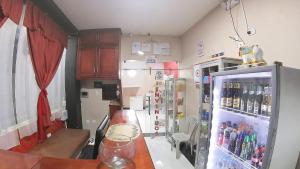 Kuchyň nebo kuchyňský kout v ubytování Hostal Flor de los Angeles Salcedo